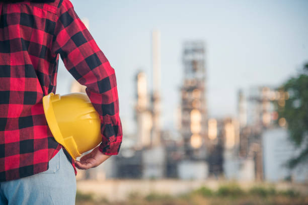 istock Woman construction engineer wear safety white hard hat at construction site industry worker. Female engineer worker civil engineering with hard hat safety helmet. Woman construction Engineer concept 1663562896
