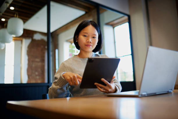 istock Businesswoman working on digital tablet at office desk 1663562937