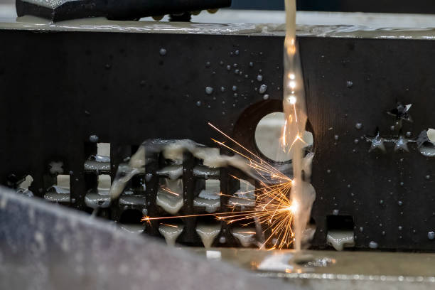 istock Closeup scene the wire EDM machine cutting the mold insert parts with the sparkling light. 1663564614