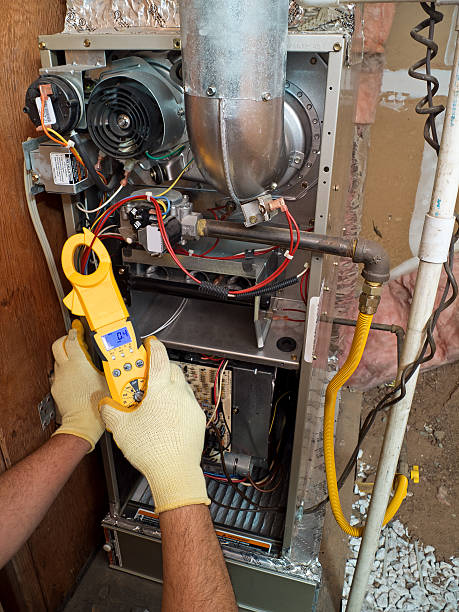 istock Hispanic air conditioning repair man fixing system 166357768