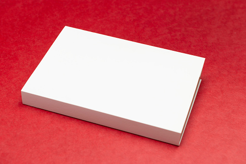 White book on red background.