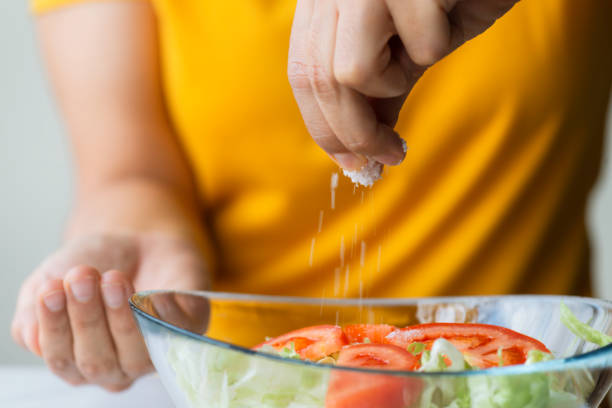 Woman Using Salt 200+ Woman Adding Salt Stock Photos, Pictures & Royalty-Free Images ...