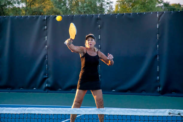 istock Female Pickleball Player Returning Volley 1663615342