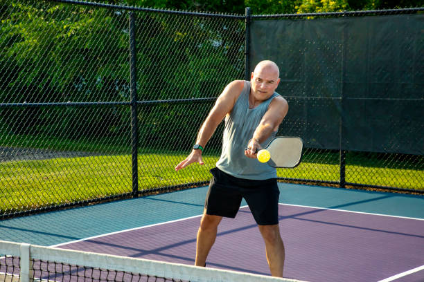 istock Male Pickleball Player Returns Volley 1663615347