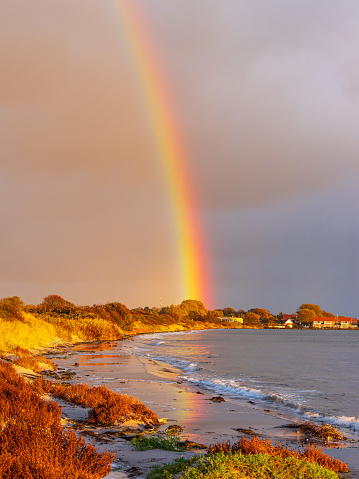 Baltic Sea coast with rainbow on the island Moen in Denmark.