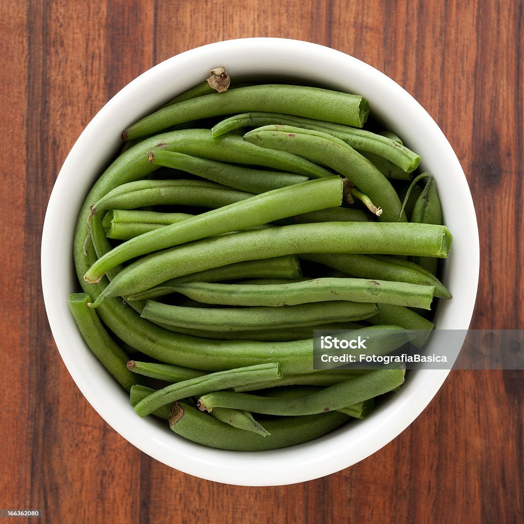 Green beans Top view of white bowl full of green beans Green Bean Stock Photo