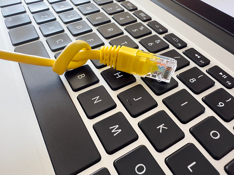 Knotted ethernet cable on a Laptop