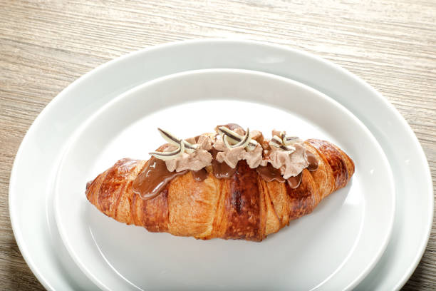 istock Chocolate Croissant Serving Dish on Wooden Table 1663635113