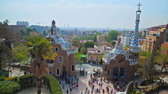 Tourists visiting Park Güell by Antoni Gaudi in Barcelona Spain Europe.