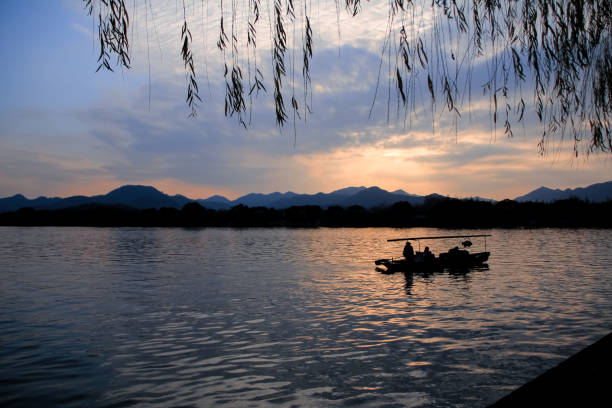 istock A calm seascape with mountains at sunset. Dramatic sky and cloudscape. 1663657285