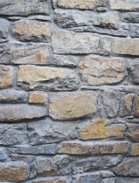 istock Brick wall background texture close up. Dirty brick wall with peeling plaster 1663659471