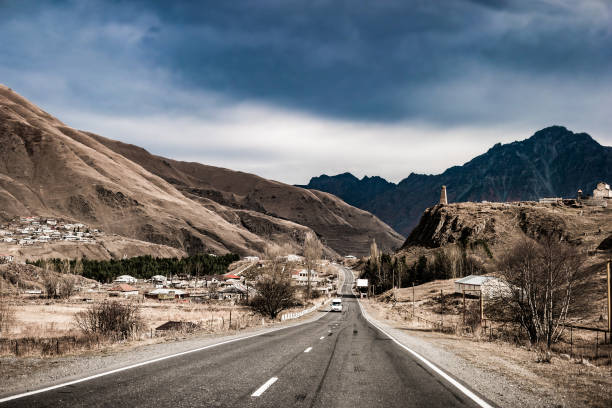 Landscape with views of military road in Georgia via traditional village