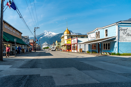 Skagway, Alaska - July 30, 2023: Tourists are walking on the street for shopping. Skagway townscape in the morning, Alaska, USA.