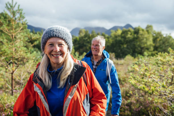 we're happy hikers - senior adult mountain hiking recreational pursuit imagens e fotografias de stock