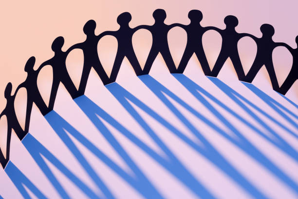 istock Paper Men Joined Together As Team, Union, Network or Family 166370215