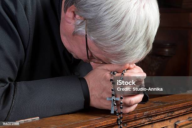 Humility Stock Photo - Download Image Now - Priest, Kneeling, Rosary Beads