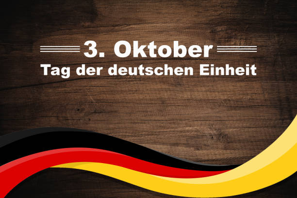 istock Germany Unity Day 3rd October. Text on a weaving flag of Germany. Tag der Deutschen Einheit. 1663734024