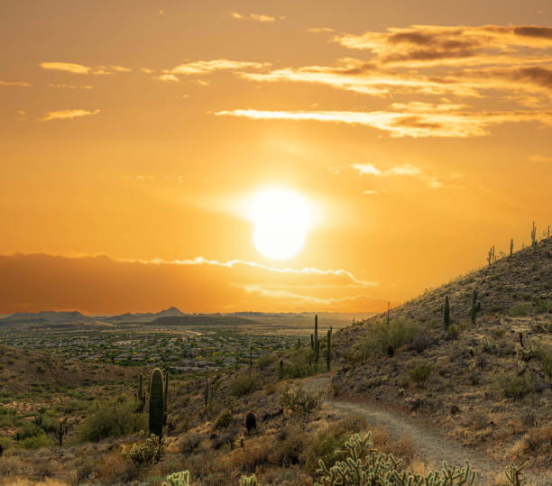 istock A desert trail on a mountain leading to a sunset over a valley in Phoenix 1663735621
