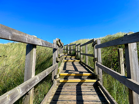 Wooden walk way leading to a beach