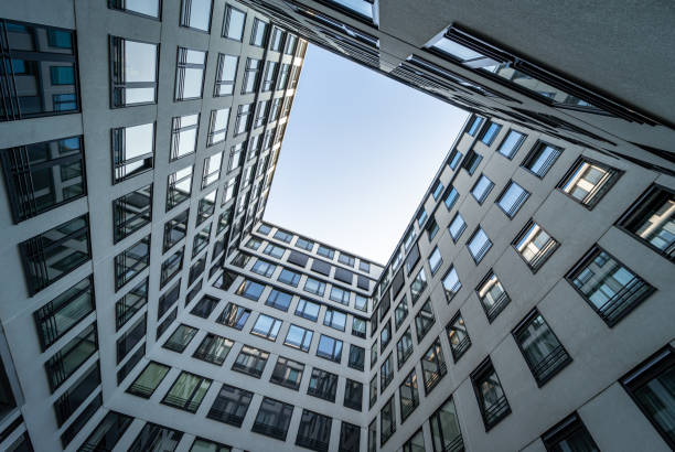 istock Low angle view of modern buildings against clear sky 1663748960