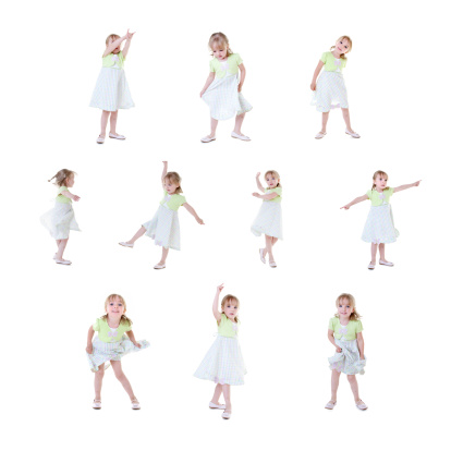 An adorable 4 year old little girl with blond hair shows off her dancing skills with all of her dance moves.