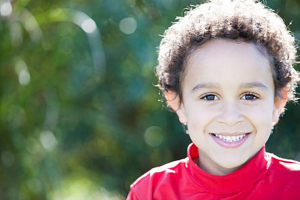 istock Real People: Smiling Mixed Race Little Boy Closeup Headshot 166377118