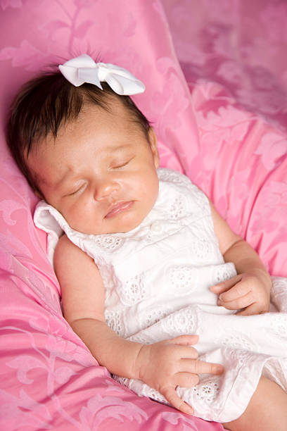 istock Precious Sleeping Newborn Baby on Pink Background 166381703