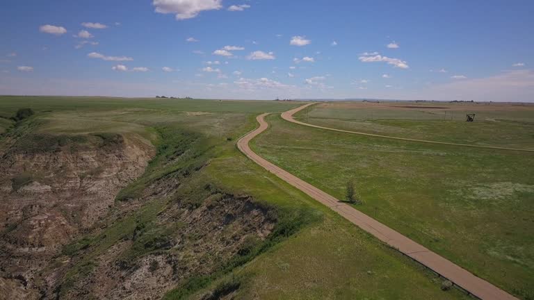 4K Vegetation and road in Drumheller, Alberta, Canada - Windy day, Aerial