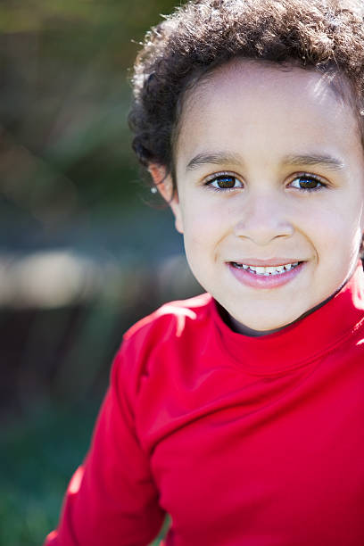 istock Real People: Smiling Mixed Race Little Boy Closeup Headshot 166381928