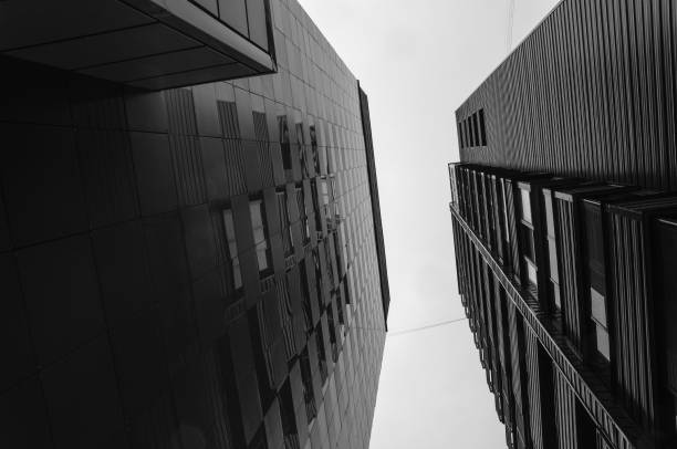 istock two high-rise buildings against gray sky 1663821102