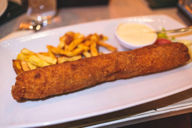 Karadjordjeva schnitzel, Karageorge Schnitzel, serbian breaded cutlet, rolled veal pork steak on a plate with french fries and kajmak, served in traditional restaurant cafe in Serbia, Montenegro