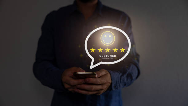 istock Close up on customer man hand pressing on smartphone screen with gold five star rating feedback icon and press level excellent rank for giving best score point to review the service, business concept 1663835220