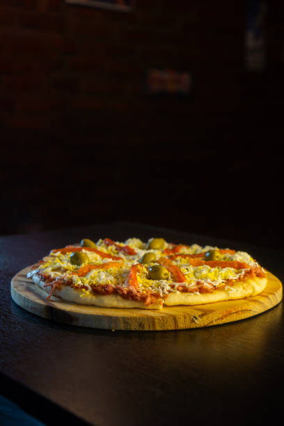 istock pizza with tomatoes . pizza napolitana 1663842352