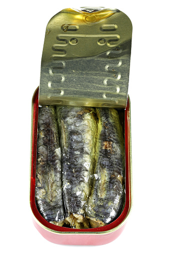 open can of sardines in vegetable oil isolated on white background