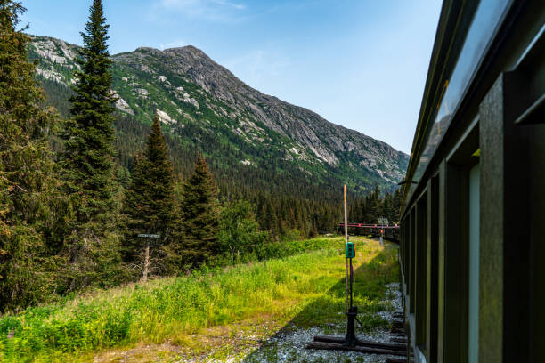 istock White Pass Summit excursion tour train in the mountains, Alaska, USA. 1663857524