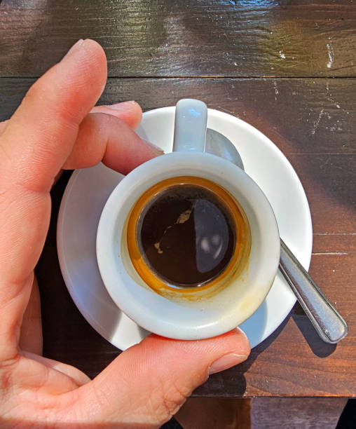 istock hand holding a cup of coffee 1663870040