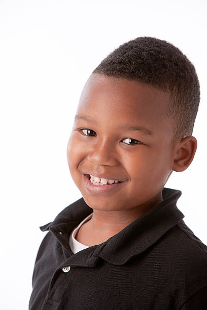 istock Real People: Black Smiling Little Boy Head Shoulders 166387508