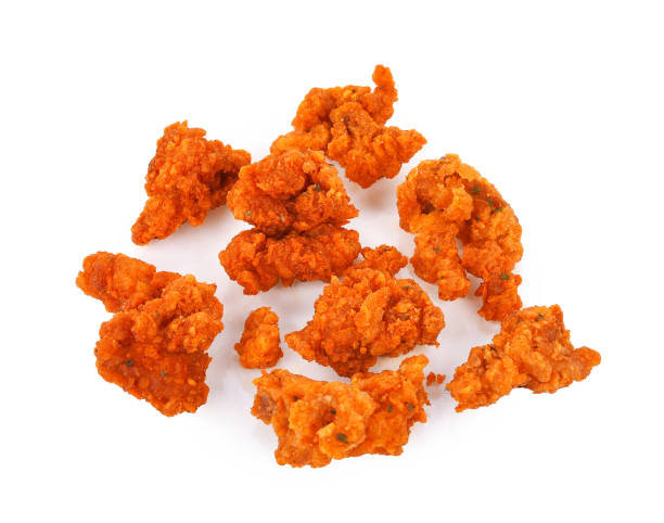 istock Fried spicy popcorn chicken isolated on white 1663907069