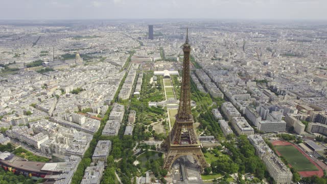 Aerial view of the Eiffel Tower and the Seine River with the city of Paris, France in the background. Cinematic 4k.