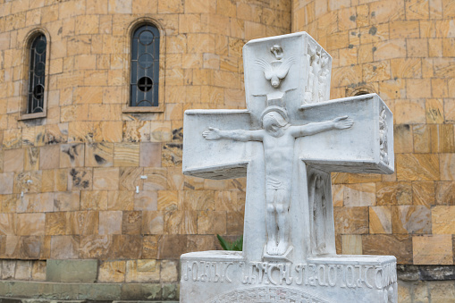 Tbilisi, Georgia - 30 August 2019: A white marble cross in the courtyard of Sioni Cathedral, Georgian Orthodox cathedral in Tbilisi, the capital of Georgia.
