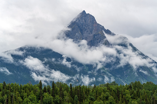 Hagwilget mountain peak in the clouds, Hazelton, British Columbia, Canada.