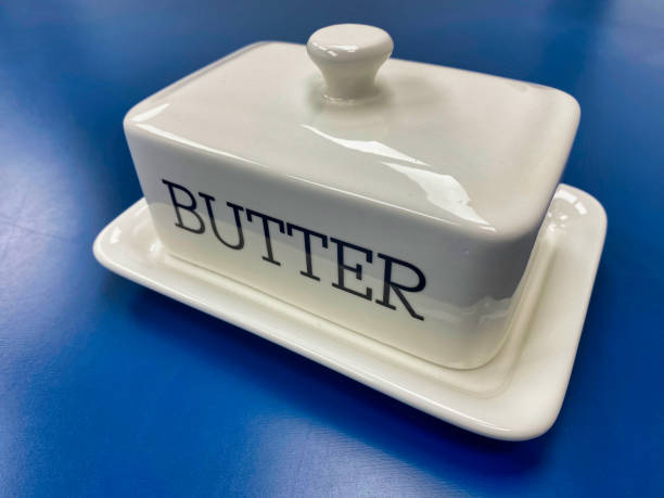 Photograph of a white china butter dish and lid