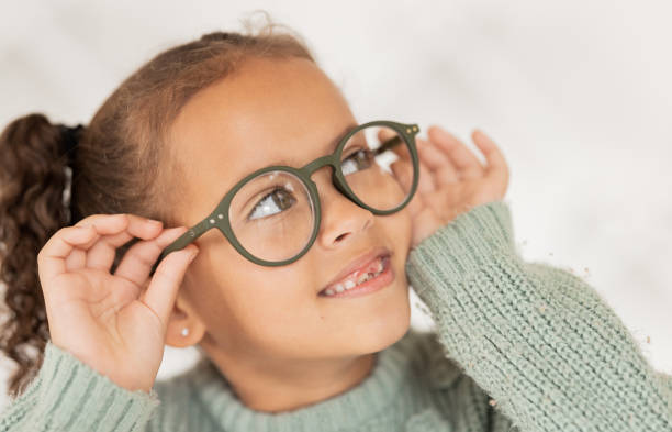 istock Child, glasses and eye care for vision, focus and concentration while wearing quality lens frame optician choice. Face of girl looking happy about optics fashion mockup for eyesight correction 1663950002
