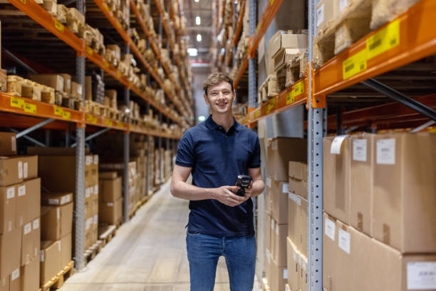 istock Portrait of a confident warehouse worker standing by storage racks 1663950597