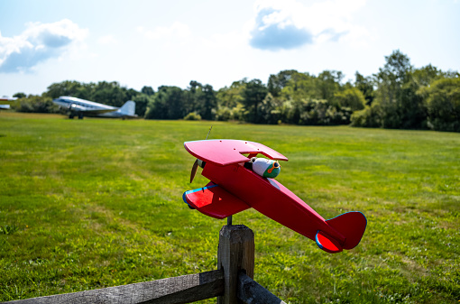 Views of a small private grass airstrip in Marstons Mills on Cape Cod in MA.  Many small planes are on the ground including several DC3s.  All runways for this airstrip are grass.