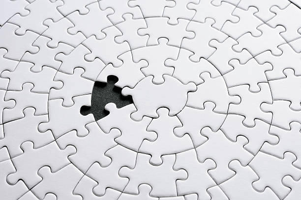 istock Missing piece of blank white jigsaw puzzle on black background 166396034