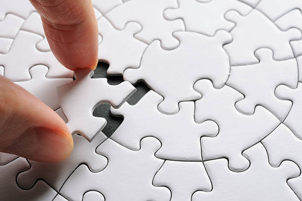 istock Holding a white blank final piece of the jigsaw 166396036