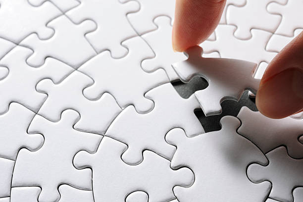 istock Holding a blank final piece of the jigsaw 166396037