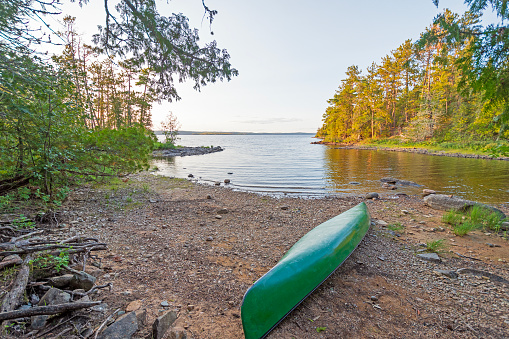 Canoe on Shore in a Quiet Cove on Saganaga Lake in the Boundary Waters Canoe Area in Minnesota