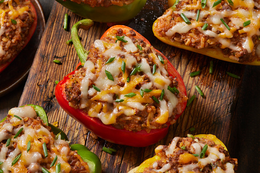 Italian Style Stuffed Peppers with Ground Beef, Rice, Tomato Sauce and Cheese